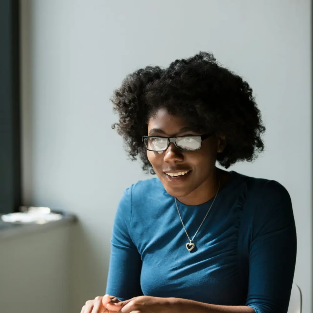 Client smiling during a counseling session at Ahava Wellness Center in Phoenix
