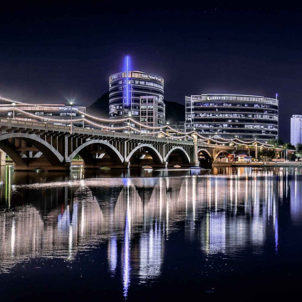 Tempe Town Lake skyline at night, part of the Phoenix Valley served by Ahava Wellness Center